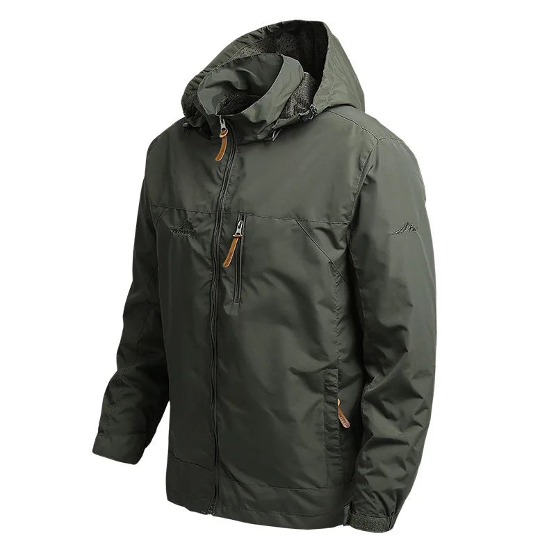 VALEWARD Vanguard Tactical Jacket in Ranger Green, three-quarter view showing the storm hood and chest pocket.
