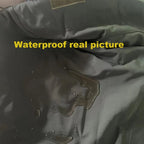 Close-up of water beading on the Bastion's face fabric, demonstrating water resistance.